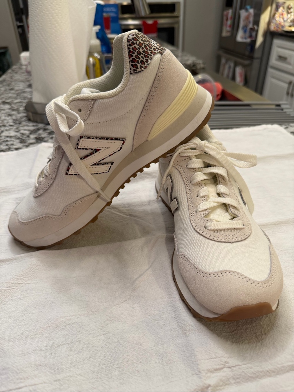 New Balance Women's Cream Sneakers with Leopard Heel Accent